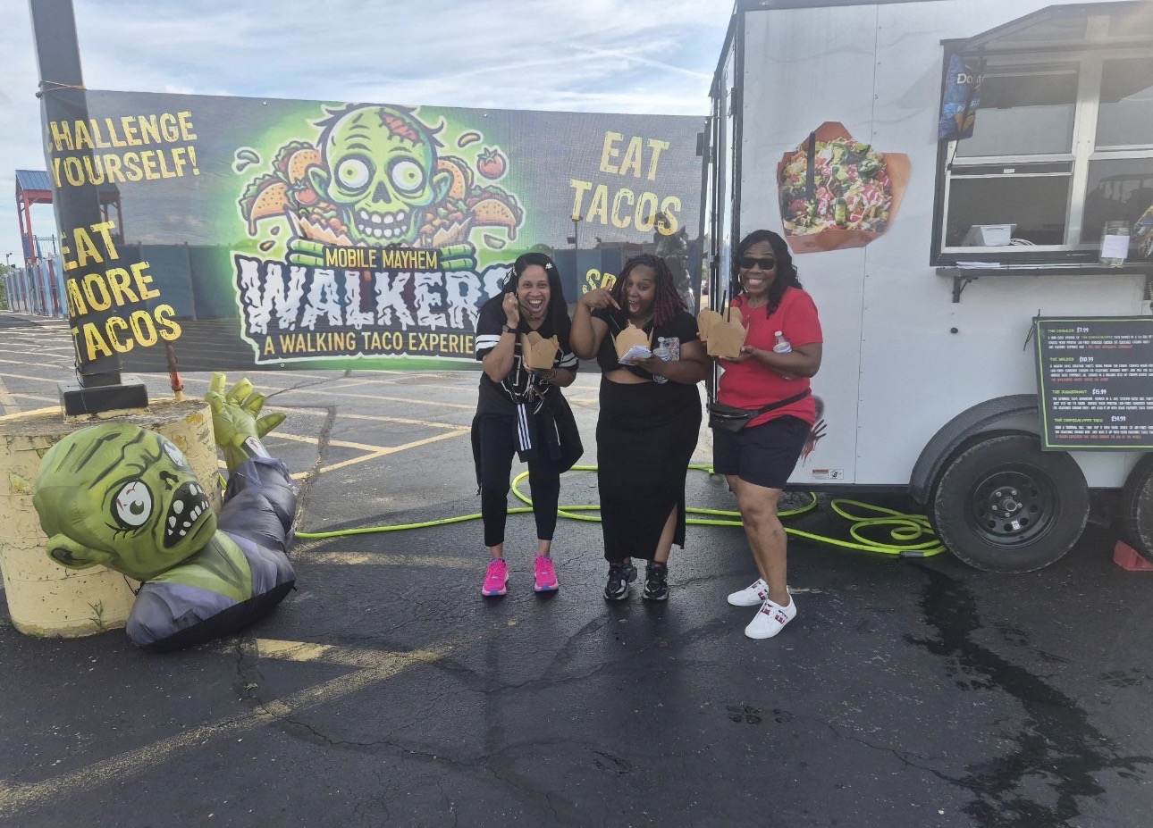 Customers enjoying tacos at Walkers Mobile Mayhem